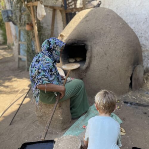 Baking flatbread in a clay oven on a farm near Luxor
