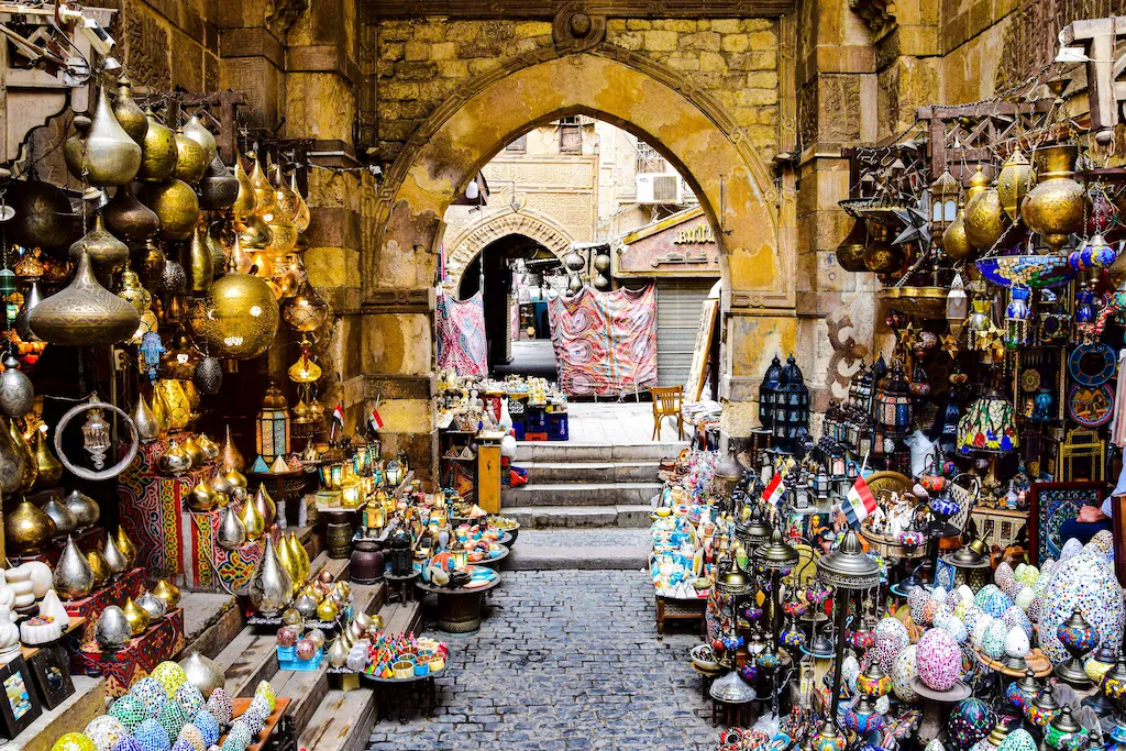 Lamps, brassware and textiles in an arcade of the Khan el-Khalili bazaar in Cairo