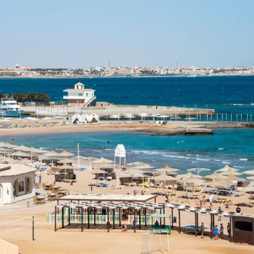 A Red Sea beach resort at Hurghada, turquoise water and palm-shaded loungers