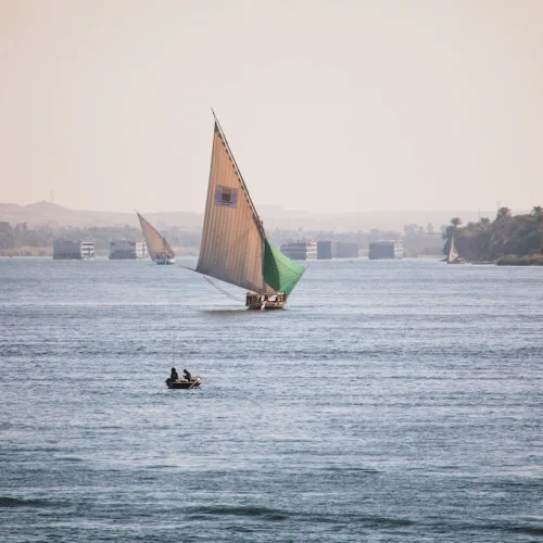 A felucca under sail on the Nile at sunset