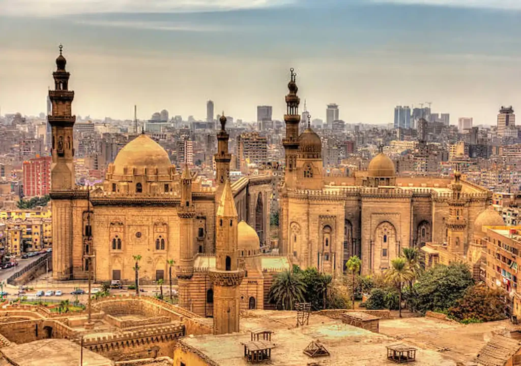 The domes and minarets of medieval Islamic Cairo seen across the rooftops