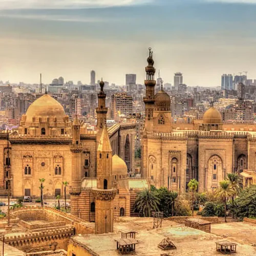 The domes and minarets of medieval Islamic Cairo seen across the rooftops