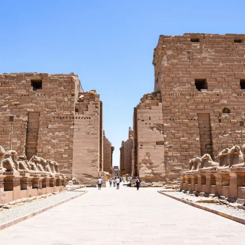 The avenue of ram-headed sphinxes leading to the first pylon of Karnak Temple in Luxor