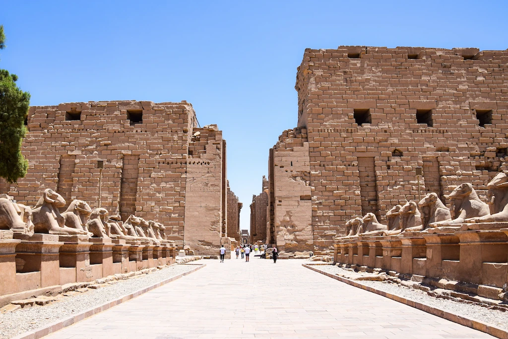 The avenue of ram-headed sphinxes leading to the first pylon of Karnak Temple in Luxor